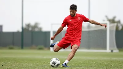A DFL video shows Bayer Leverkusen defender Edmond Tapsoba accidentally passing the ball to coach Xabi Alonso during...